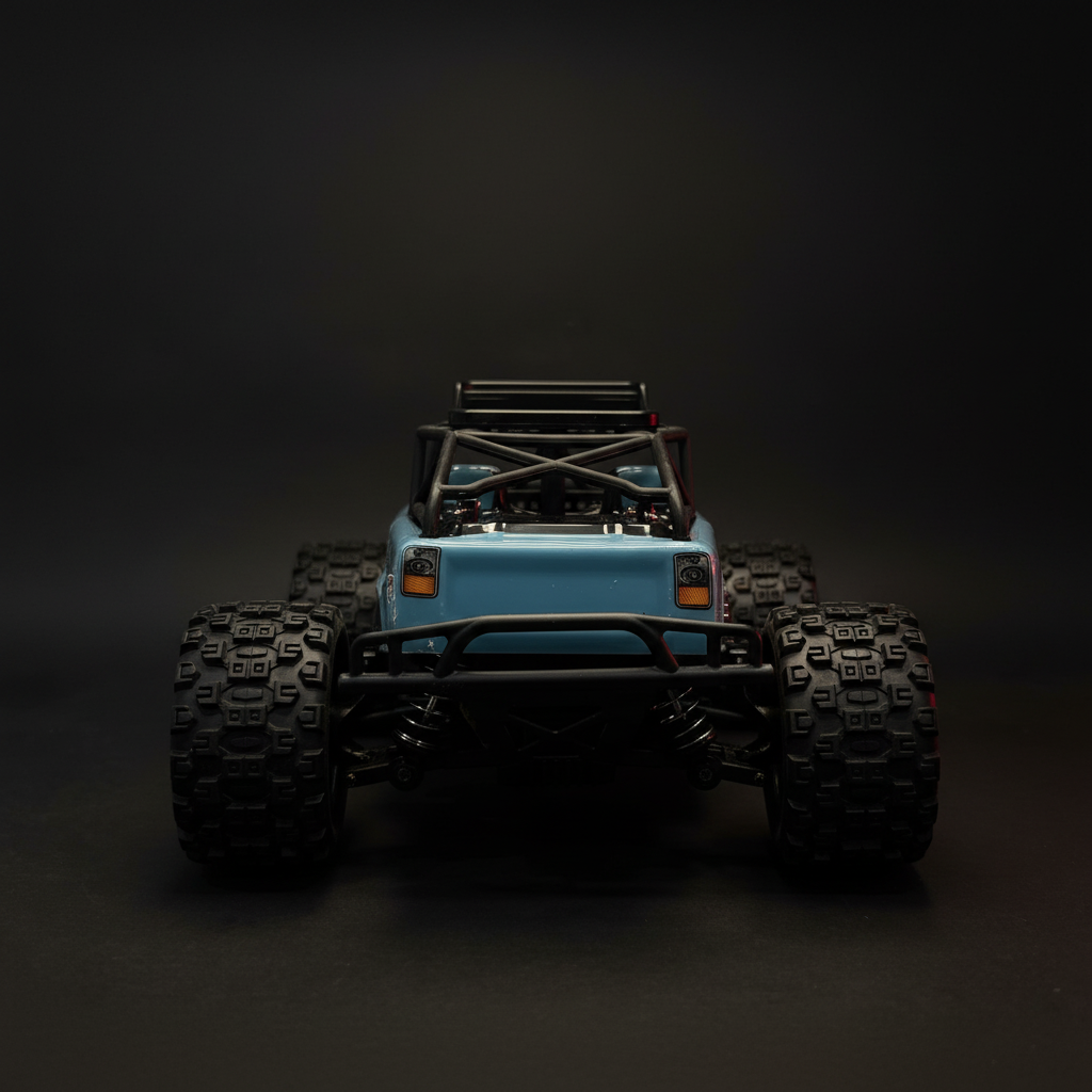 Strong Sandstorm RC Monster Truck – low angle front 3/4 dark background